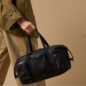 Women’s black travel overnight bag Anya Hindmarch